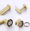 Brushed gold toilet paper holder mounted on L-tube pins